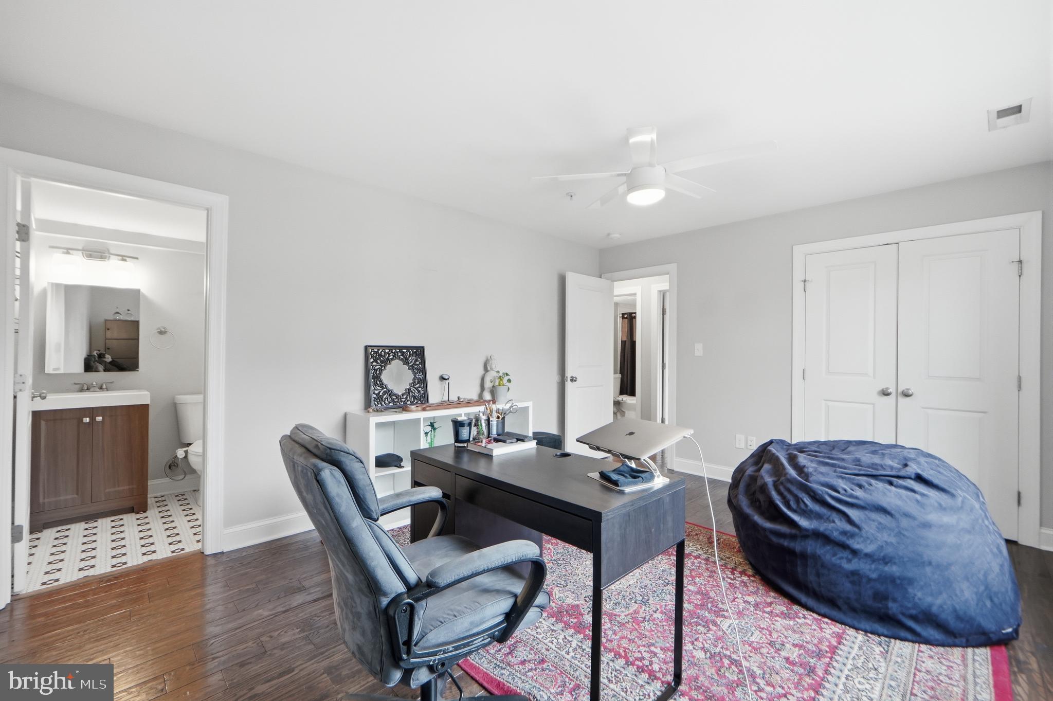 1258 Holbrook Terrace Northeast, Unit 5 Washington, DC 20002 - Photo 17 of 25 a view of a workspace with furniture and wooden floor
