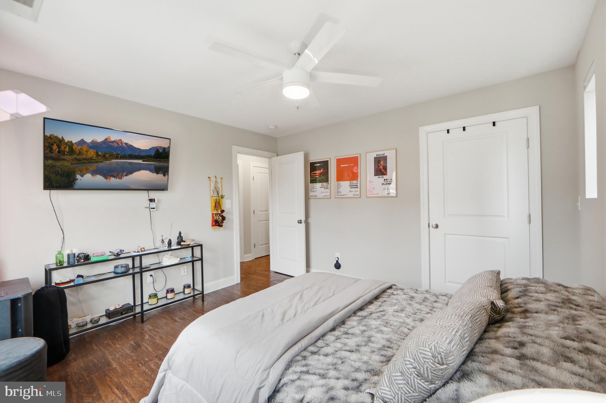 1258 Holbrook Terrace Northeast, Unit 5 Washington, DC 20002 - Photo 20 of 25 a bedroom with a bed and a flat screen tv