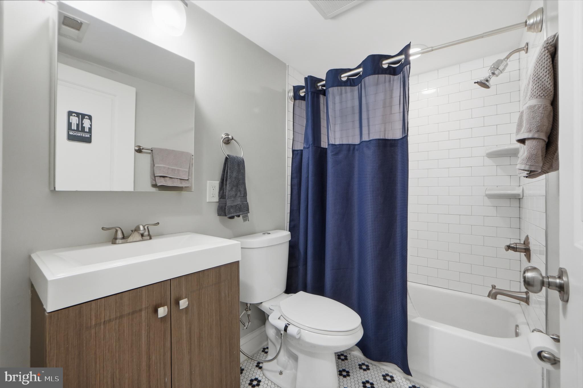 1258 Holbrook Terrace Northeast, Unit 5 Washington, DC 20002 - Photo 21 of 25 a bathroom with a sink toilet and shower