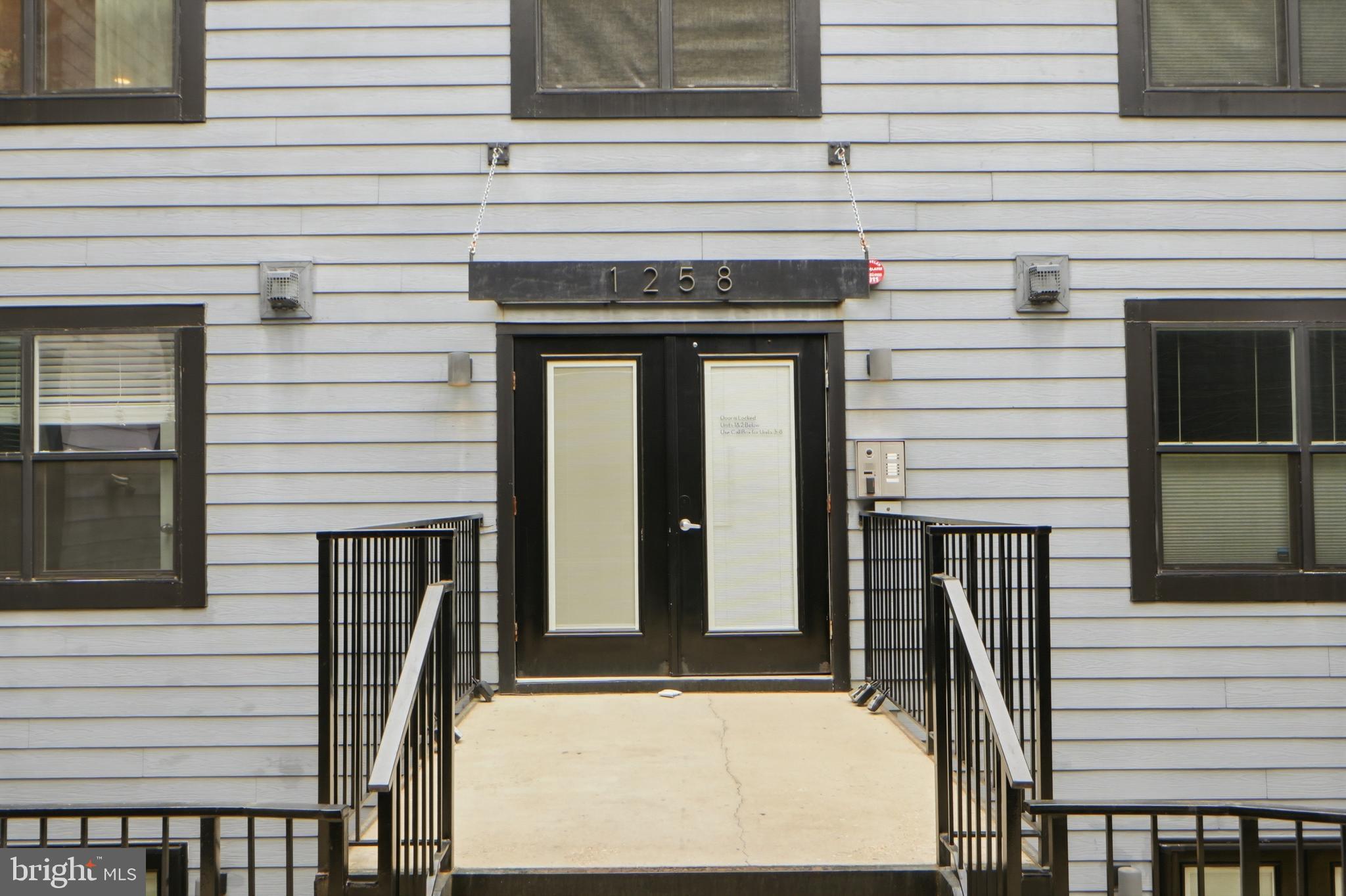 1258 Holbrook Terrace Northeast, Unit 5 Washington, DC 20002 - Photo 4 of 25 a front view of a house with large windows