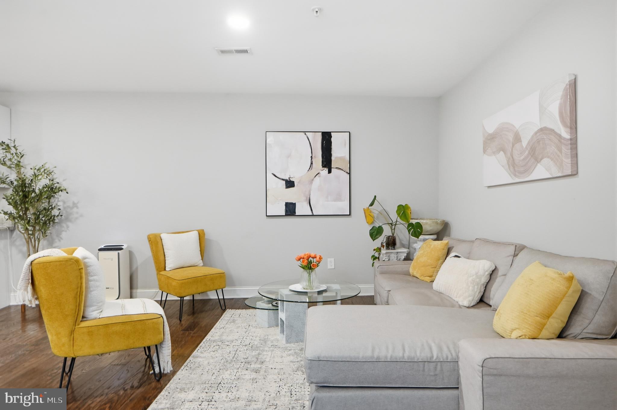 1258 Holbrook Terrace Northeast, Unit 5 Washington, DC 20002 - Photo 6 of 25 a living room with furniture and a couch