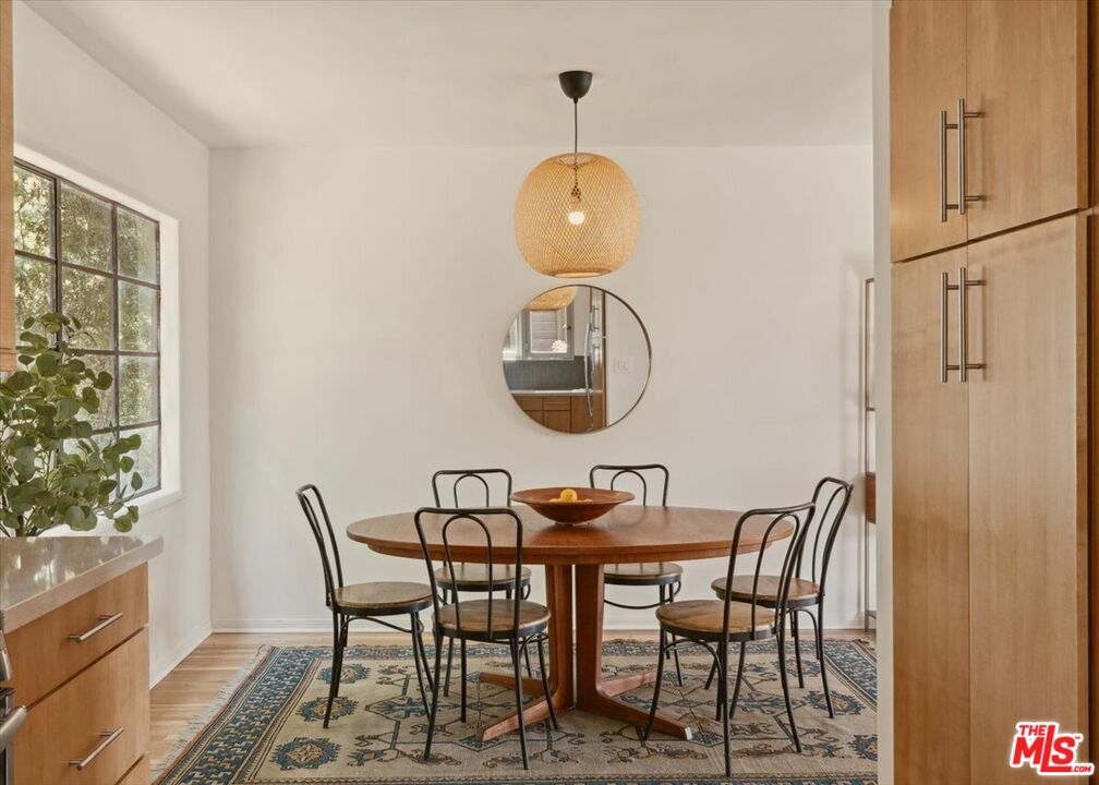2467 Silver Ridge Avenue Los Angeles, CA 90039 - Photo 12 of 42 a view of a dining room with furniture and wooden floor