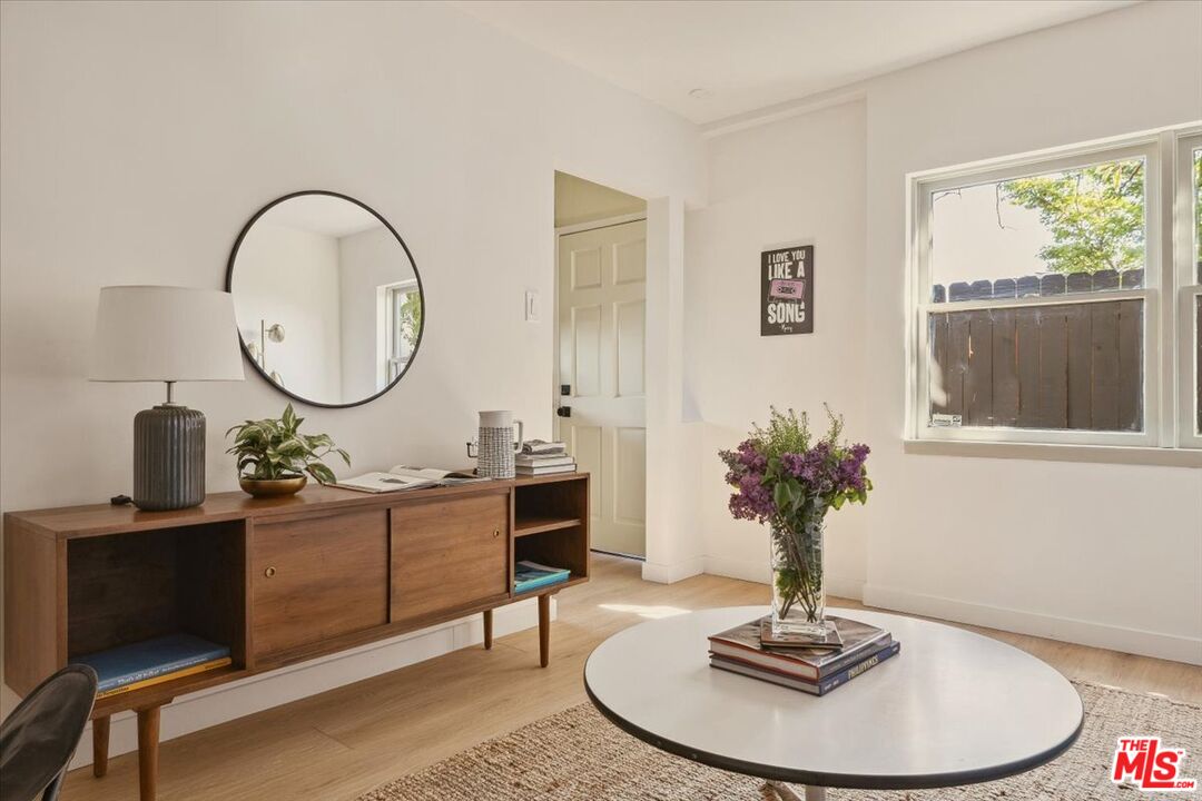 2467 Silver Ridge Avenue Los Angeles, CA 90039 - Photo 22 of 42 a living room with furniture a window and a potted plant