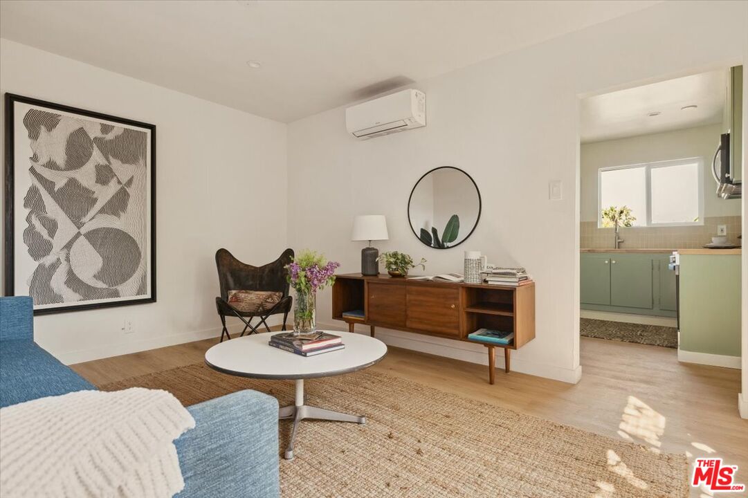 2467 Silver Ridge Avenue Los Angeles, CA 90039 - Photo 23 of 42 a living room with furniture a rug and a table