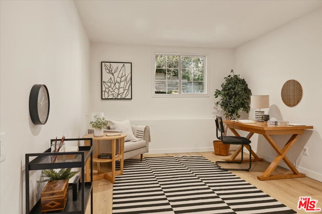 2467 Silver Ridge Avenue Los Angeles, CA 90039 - Photo 29 of 42 a living room with furniture a rug and a window