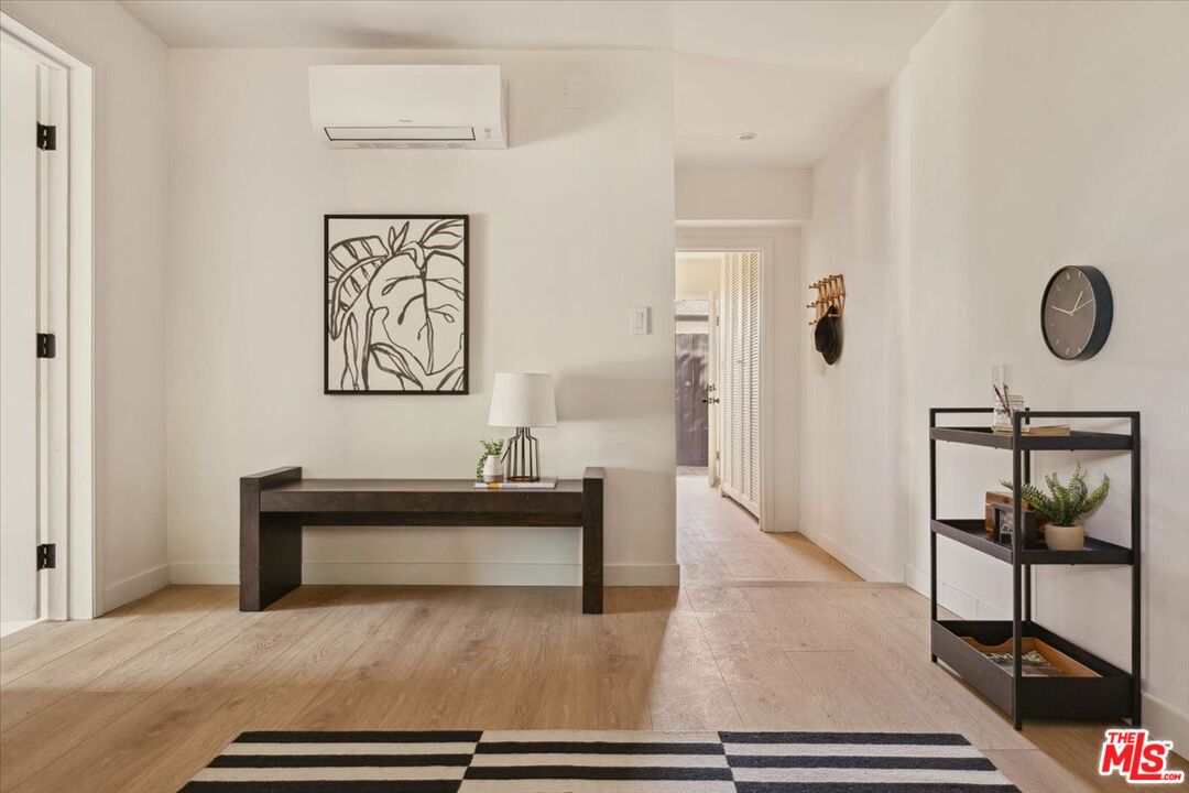2467 Silver Ridge Avenue Los Angeles, CA 90039 - Photo 30 of 42 a view of a hallway with wooden floor and furniture