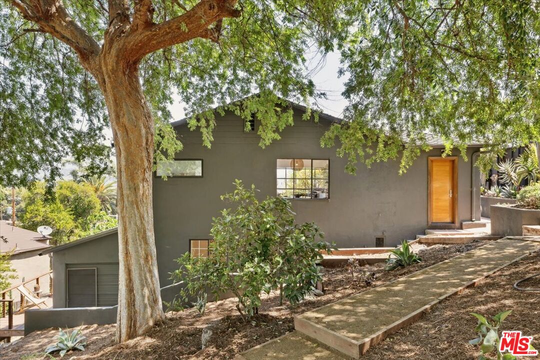 2467 Silver Ridge Avenue Los Angeles, CA 90039 - Photo 37 of 42 a tree in front of a house