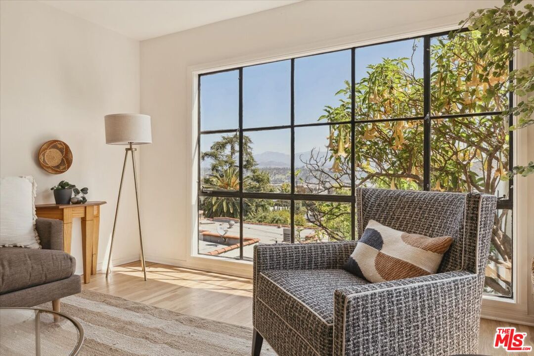 2467 Silver Ridge Avenue Los Angeles, CA 90039 - Photo 9 of 42 a living room with furniture and a floor to ceiling window