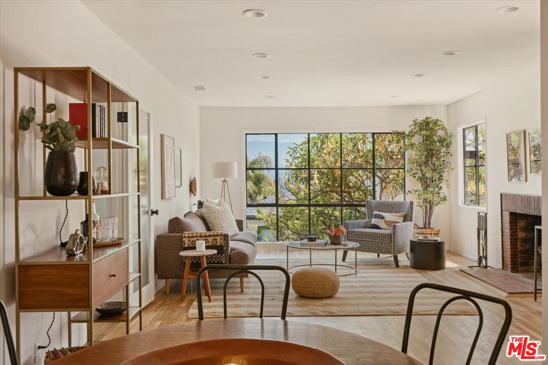 2467 Silver Ridge Avenue Los Angeles, CA 90039 - Photo 10 of 42 a living room with furniture floor to ceiling window and wooden floor