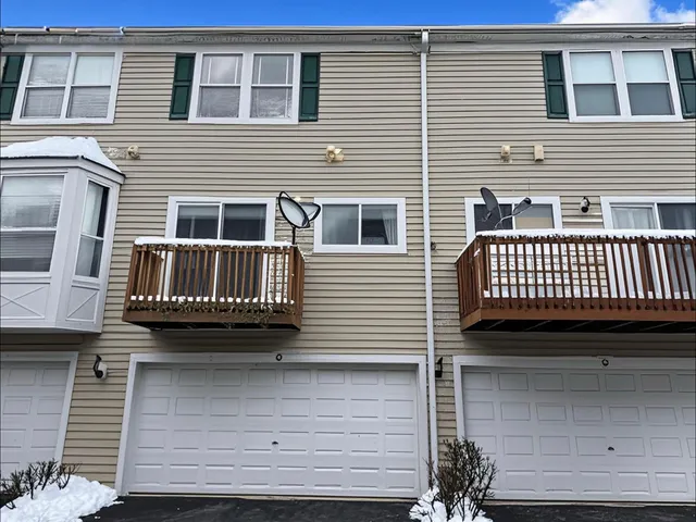 a view of a house with a door and a window