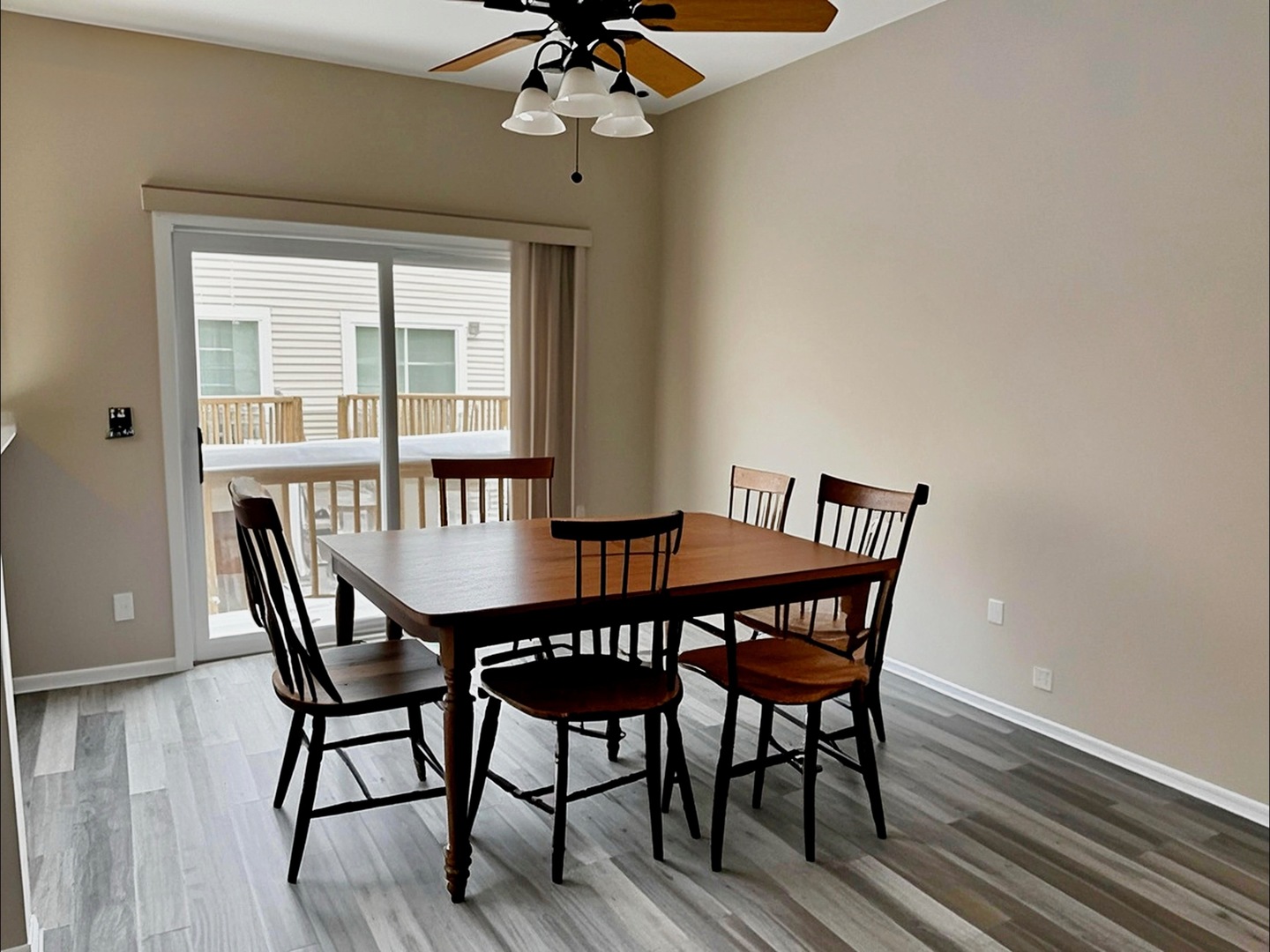 1116 Village Center Parkway Aurora, IL 60506 - Photo 3 of 16 a view of a dining room with furniture wooden floor and chandelier