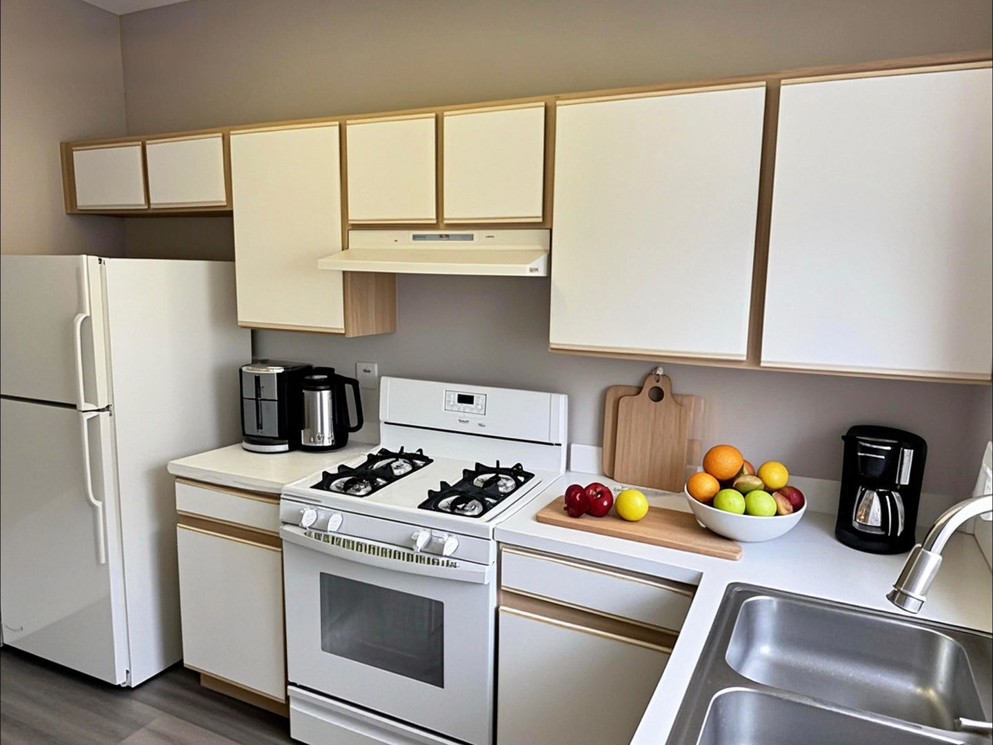 1116 Village Center Parkway Aurora, IL 60506 - Photo 5 of 16 a kitchen with stainless steel appliances a stove a refrigerator and a sink