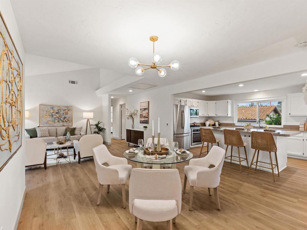 13737 Temple Street Poway, CA 92064 - Photo 10 of 38 a view of a dining room with furniture window and wooden floor