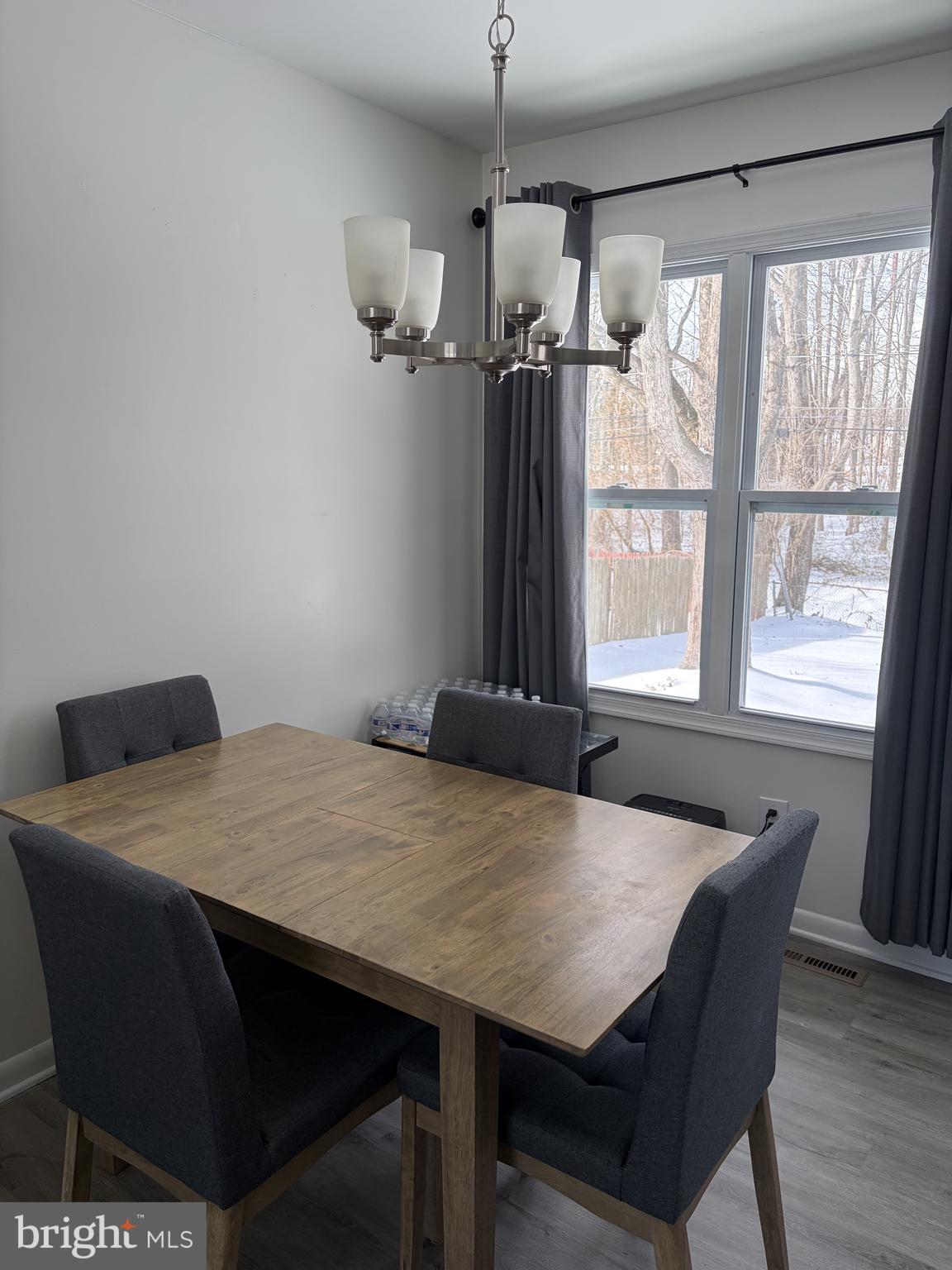 151 West Rutherford Drive Newark, DE 19713 - Photo 2 of 6 a view of a dining room with furniture window and wooden floor
