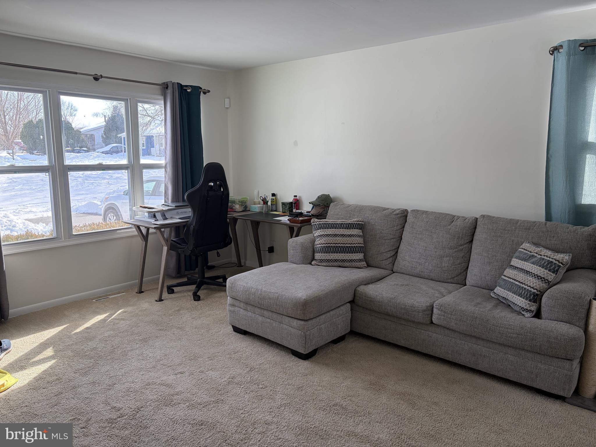 151 West Rutherford Drive Newark, DE 19713 - Photo 3 of 6 a living room with furniture and a large window