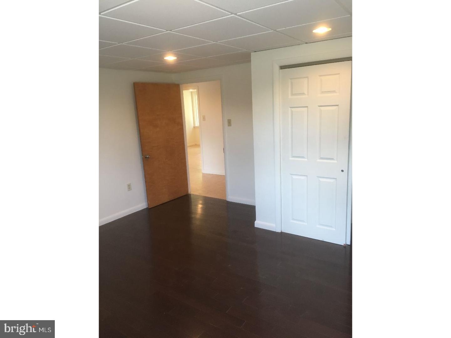 4 Beryl Road Paoli, PA 19301 - Photo 6 of 12 a view of an empty room with wooden floor