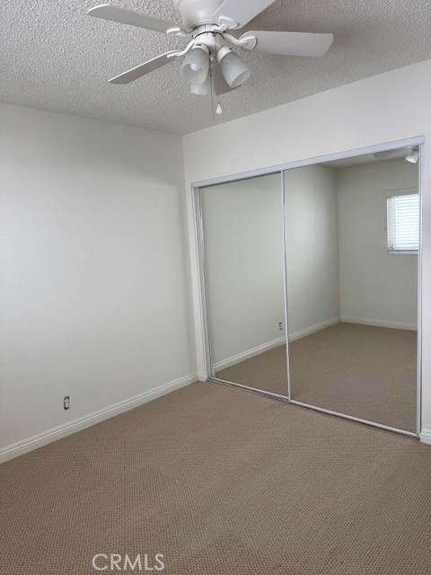 207 West Marquita, Unit 6 San Clemente, CA 92672 - Photo 11 of 15 an empty room with a ceiling fan and window