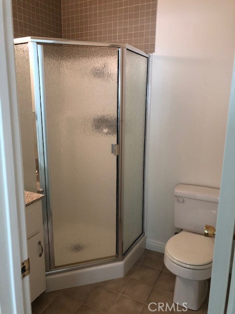 207 West Marquita, Unit 6 San Clemente, CA 92672 - Photo 15 of 15 a bathroom with a granite countertop toilet and a shower