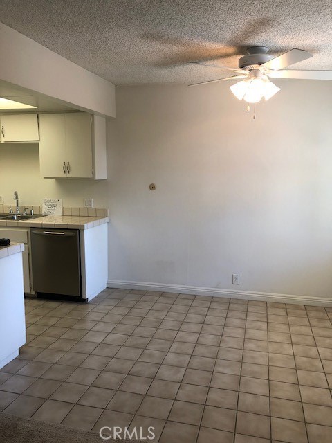 207 West Marquita, Unit 6 San Clemente, CA 92672 - Photo 6 of 15 a view of kitchen with granite countertop white cabinets and a sink
