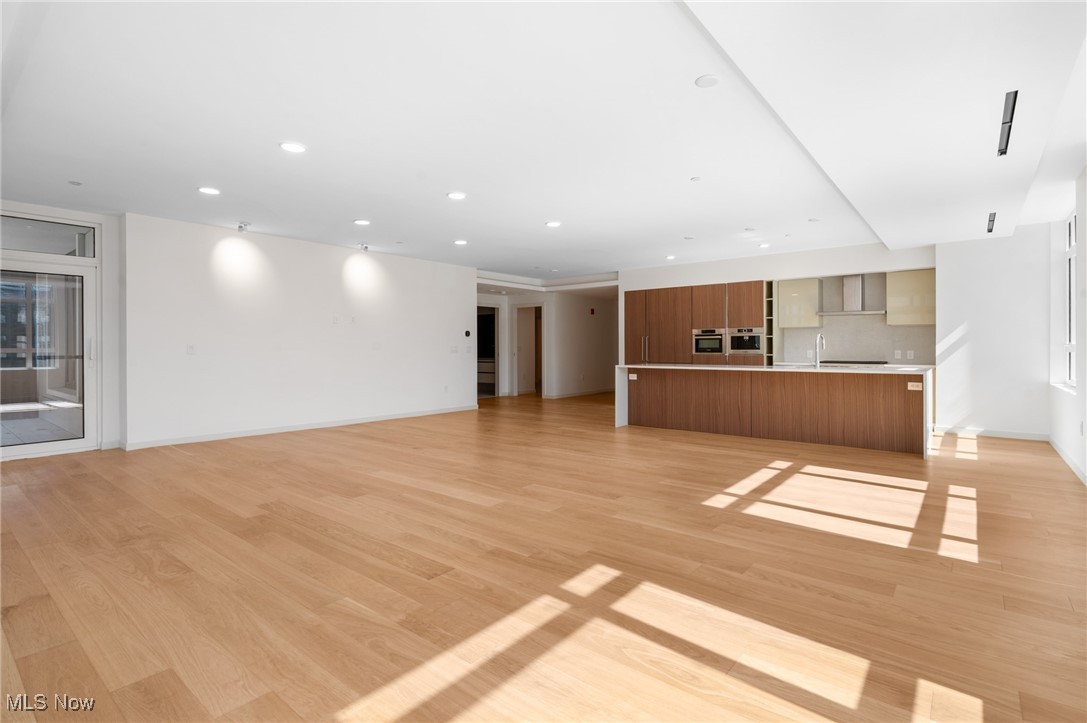 22700 Lake Road, Unit 306 Rocky River, OH 44116 - Photo 7 of 28 Unfurnished living room featuring recessed lighting and light wood-style flooring