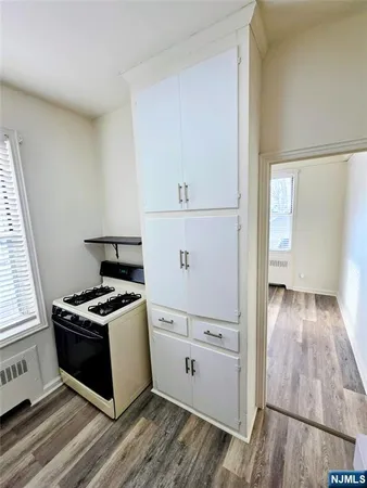 a kitchen with stainless steel appliances a stove and a refrigerator
