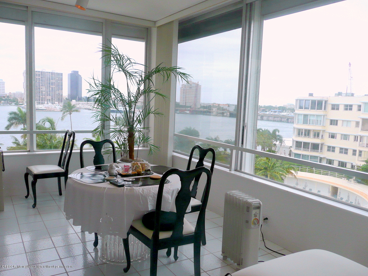 44 Cocoanut Row, Unit 510B 511B Palm Beach, FL 33480 - Photo 2 of 15 a dining room with furniture a chandelier and fireplace