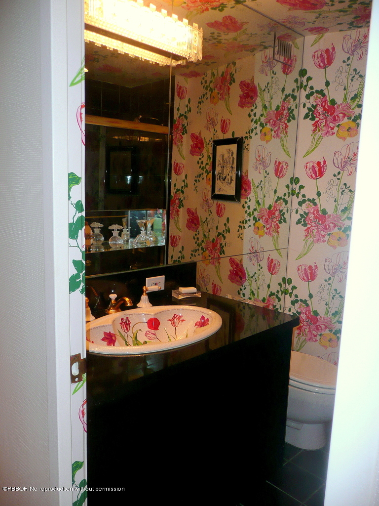 44 Cocoanut Row, Unit 510B 511B Palm Beach, FL 33480 - Photo 7 of 15 a bathroom with a sink and a mirror
