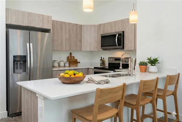 a kitchen with a dining table and chairs