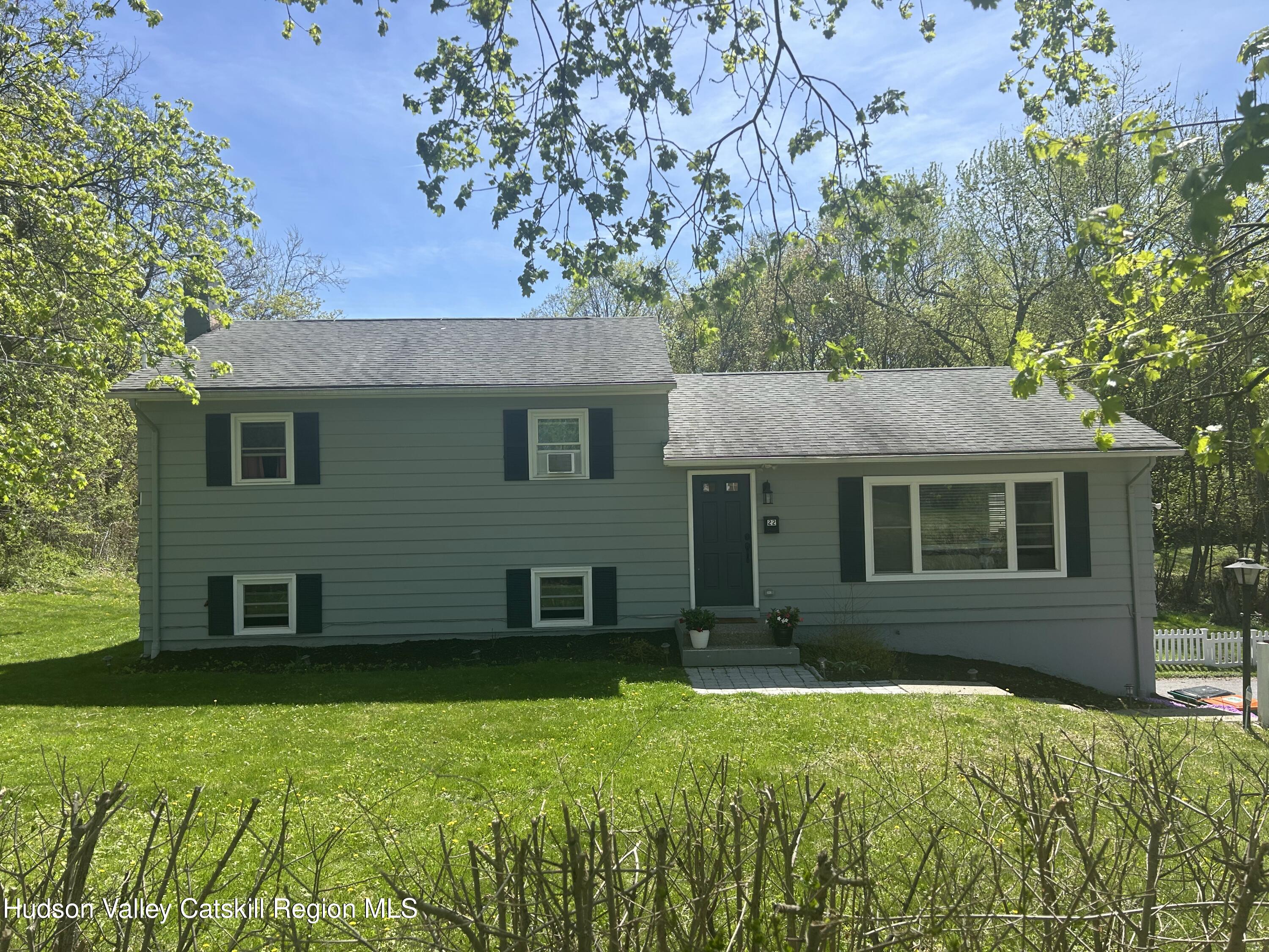 22 Caywood Road Poughkeepsie, NY 12603 - Photo 2 of 27 a front view of a house with a yard