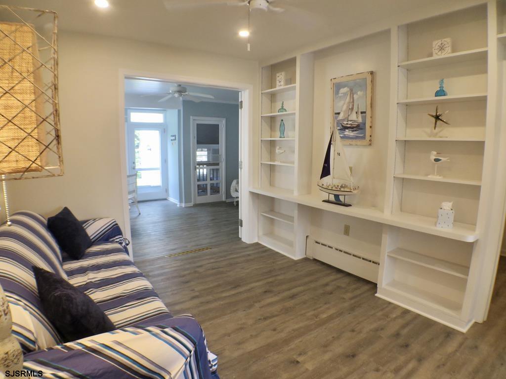 814 Wesley Road Ocean City, NJ 08226 - Photo 11 of 29 a living room with furniture and wooden floor