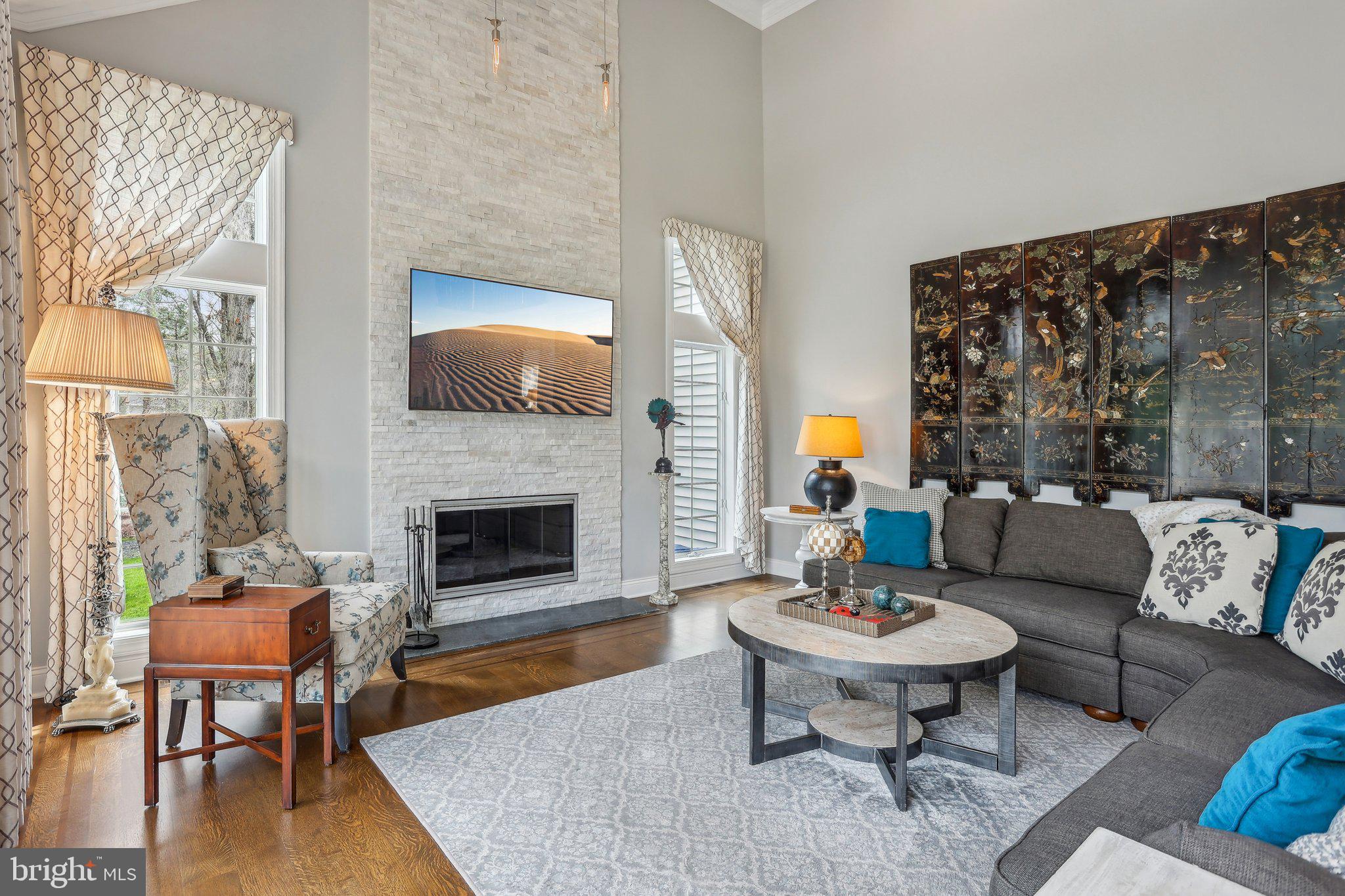 6 Stowe Drive Shamong, NJ 08088 - Photo 15 of 76 a living room with furniture a fireplace and a table