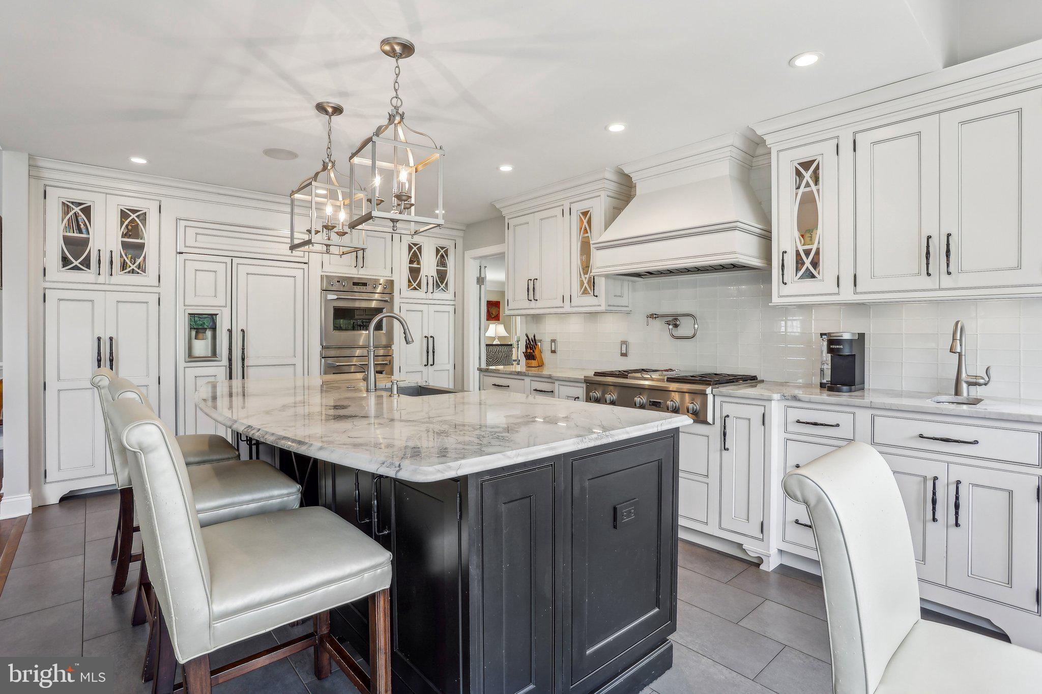 6 Stowe Drive Shamong, NJ 08088 - Photo 18 of 76 a kitchen with cabinets a sink dining table and chairs