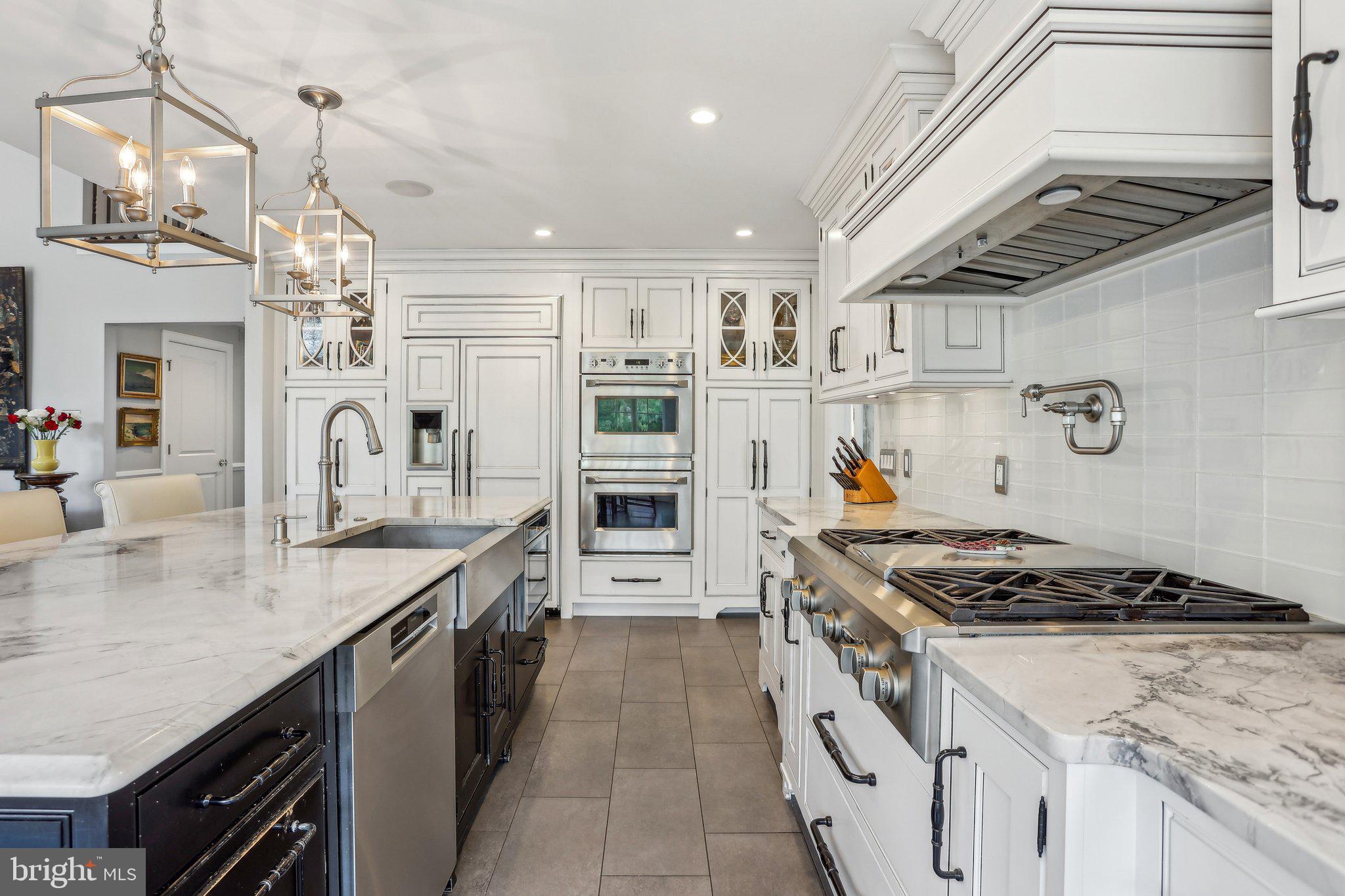 6 Stowe Drive Shamong, NJ 08088 - Photo 19 of 76 a kitchen with stainless steel appliances granite countertop a stove and a sink