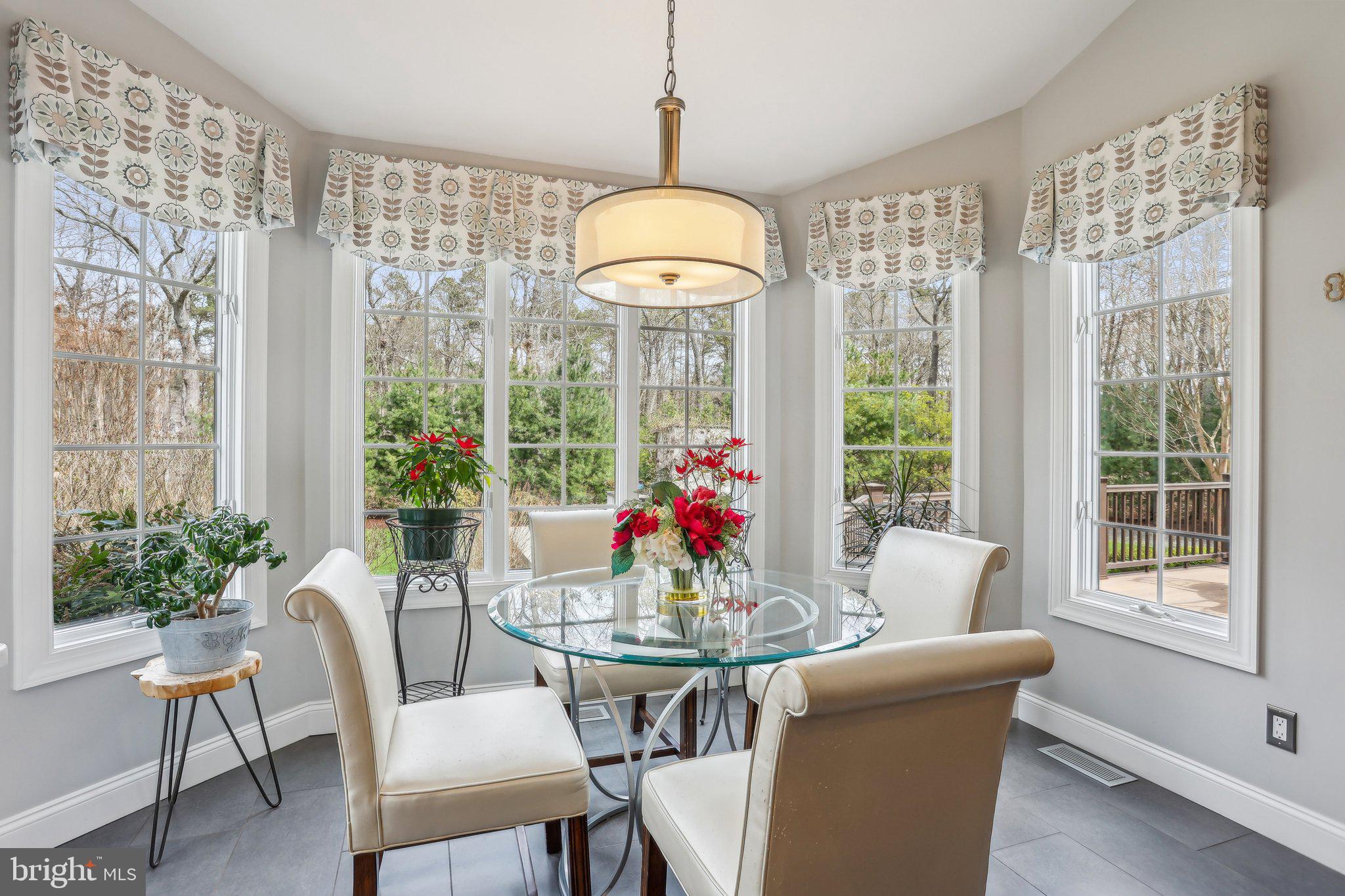 6 Stowe Drive Shamong, NJ 08088 - Photo 22 of 76 a dining room with furniture a chandelier and wooden floor