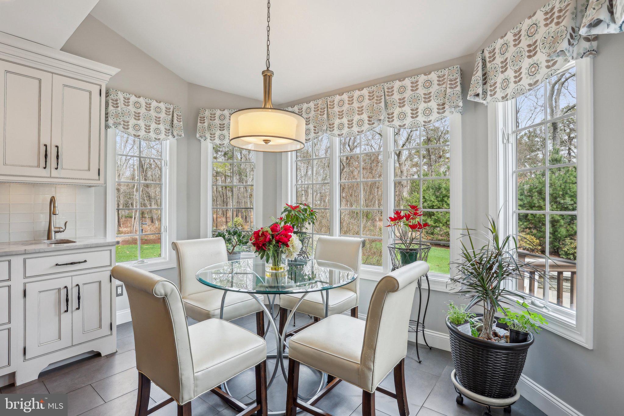 6 Stowe Drive Shamong, NJ 08088 - Photo 23 of 76 a dining room with furniture a chandelier and wooden floor