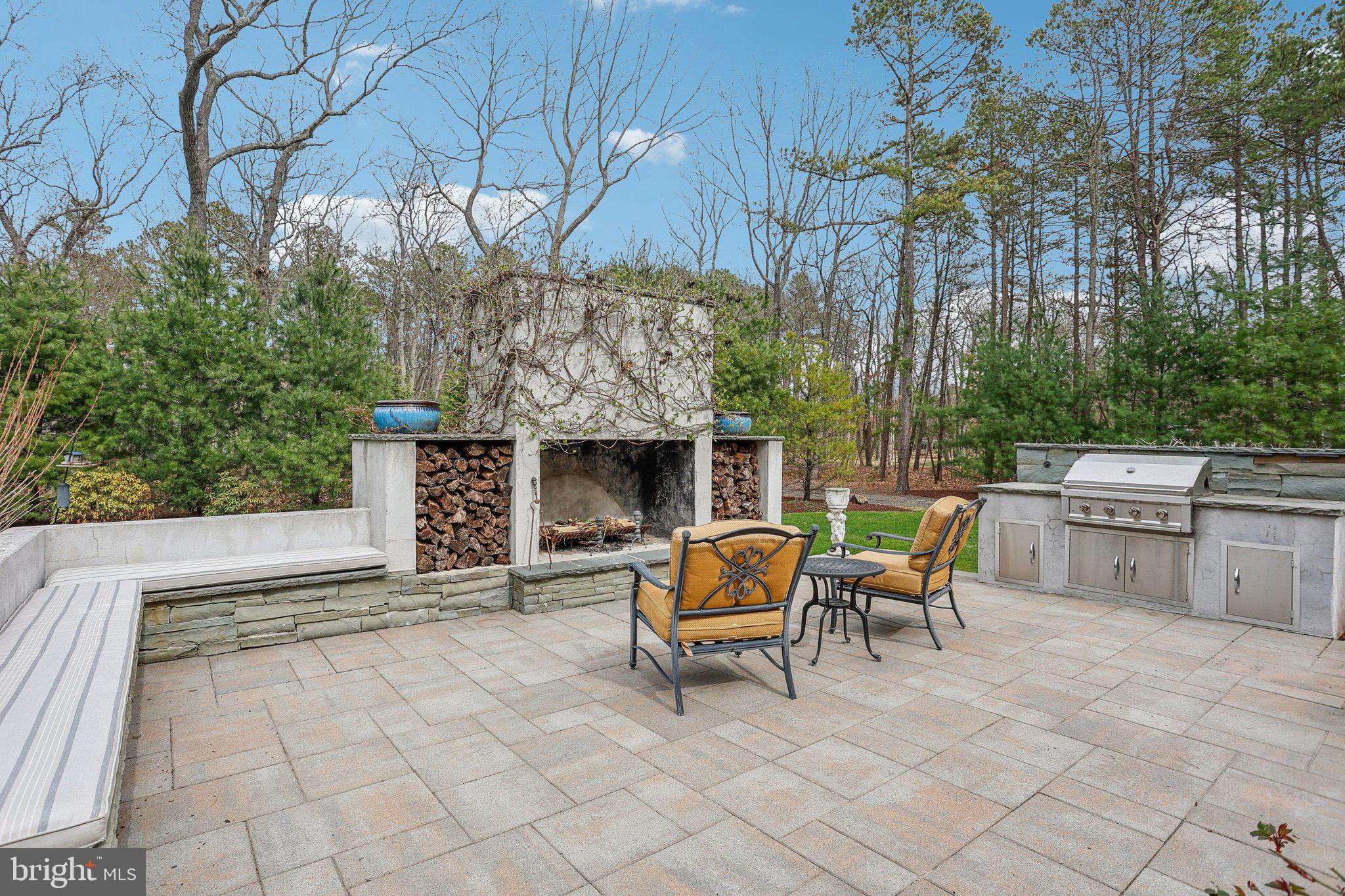 6 Stowe Drive Shamong, NJ 08088 - Photo 58 of 76 a view of a chairs and table in the back yard of the house