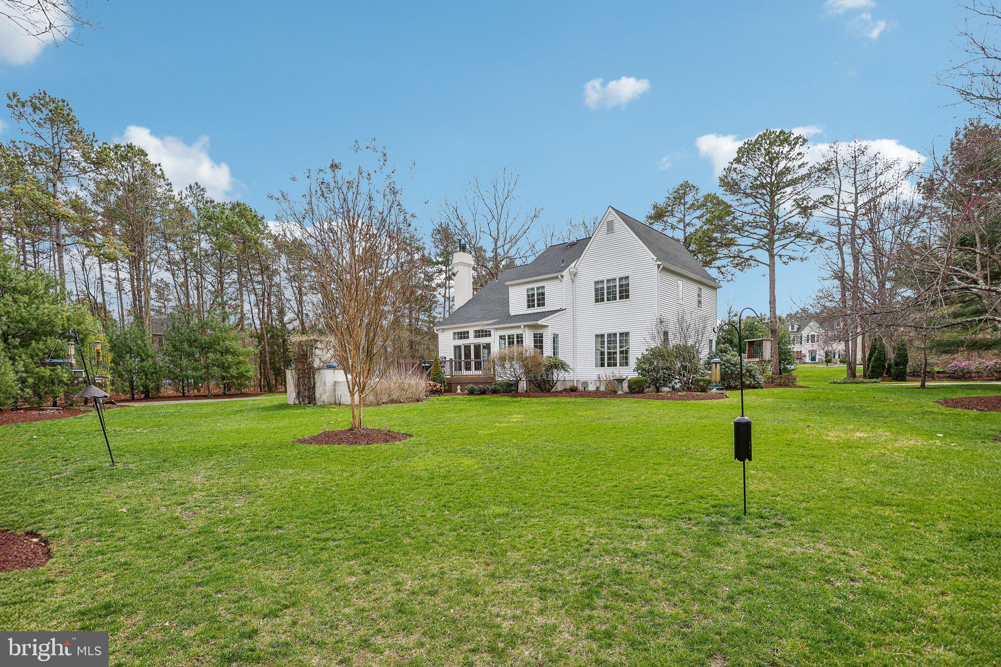 6 Stowe Drive Shamong, NJ 08088 - Photo 65 of 76 a garden with trees in the background