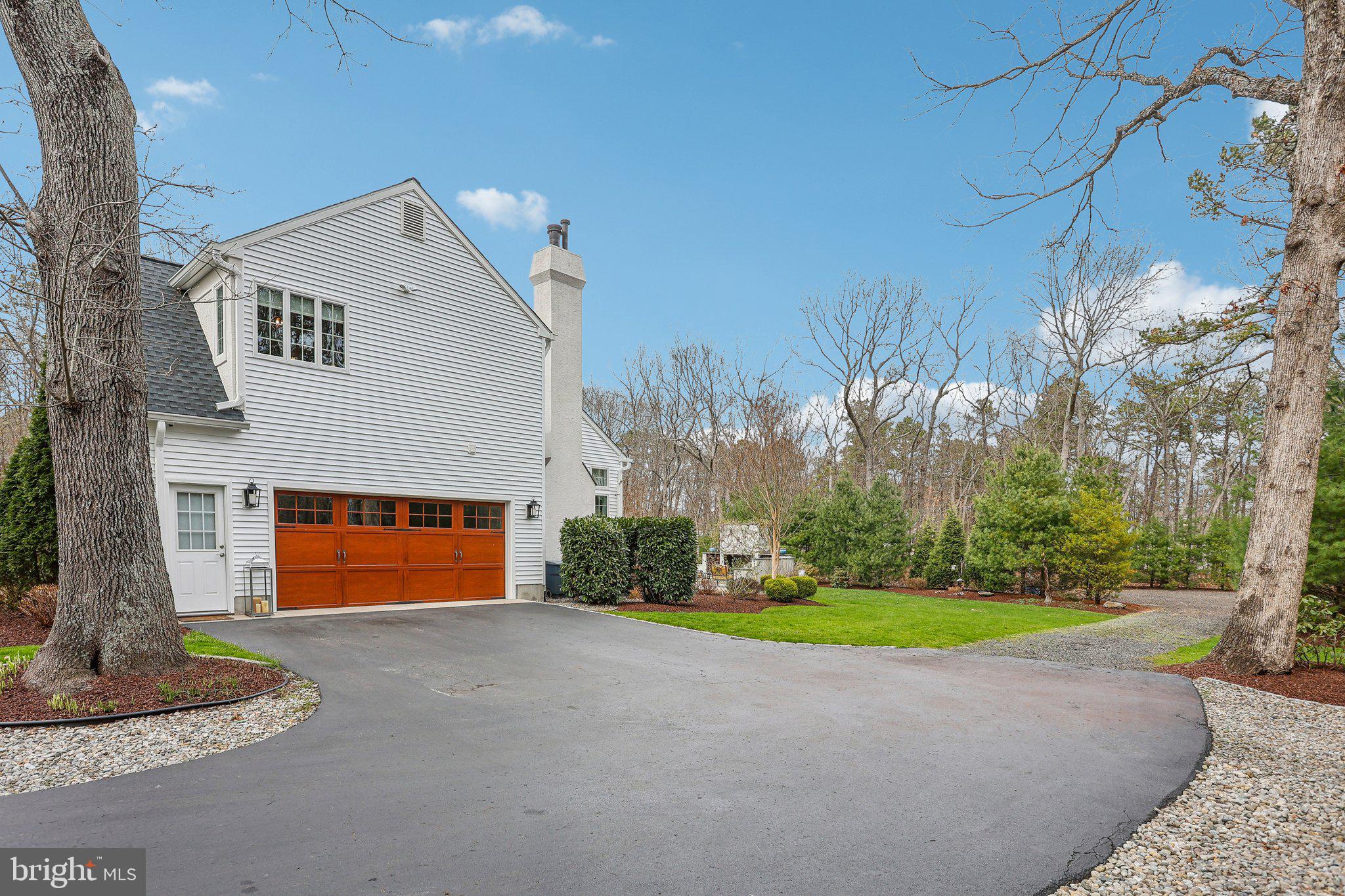 6 Stowe Drive Shamong, NJ 08088 - Photo 69 of 76 a front view of a house with a yard and garage