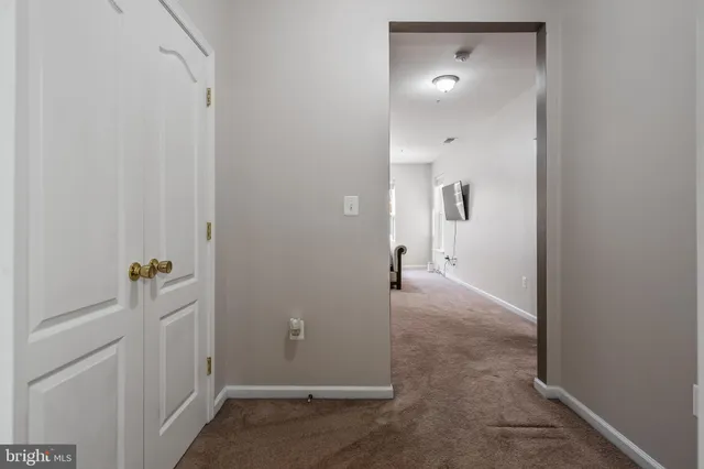 a bathroom with a sink a light fixture and a mirror