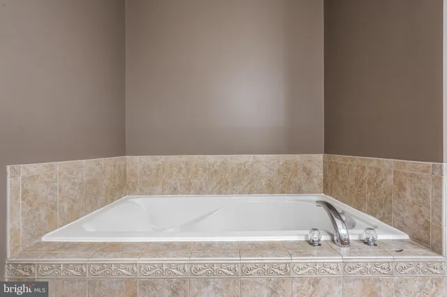 a bedroom with a bed and pillows