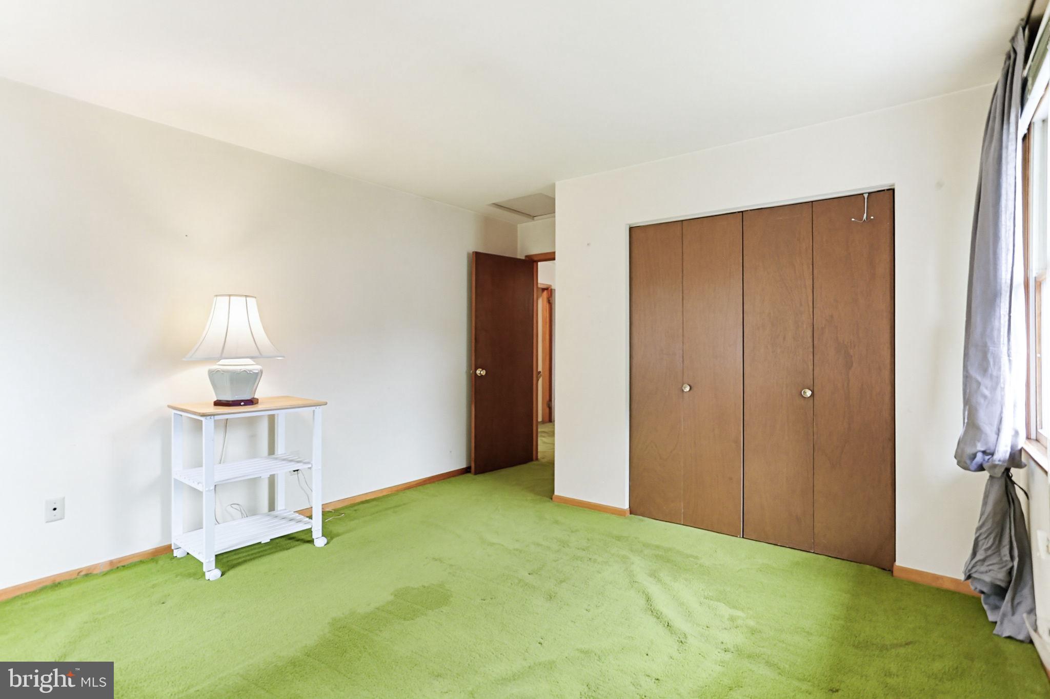 9301 Gardenia Road Baltimore, MD 21236 - Photo 20 of 37 a view of an empty room with a fireplace and a window