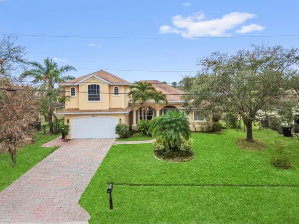 a view of a garden with a building