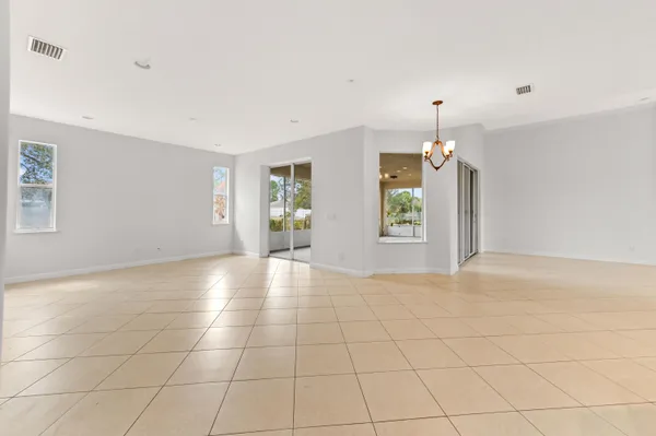 a view of an empty room with windows