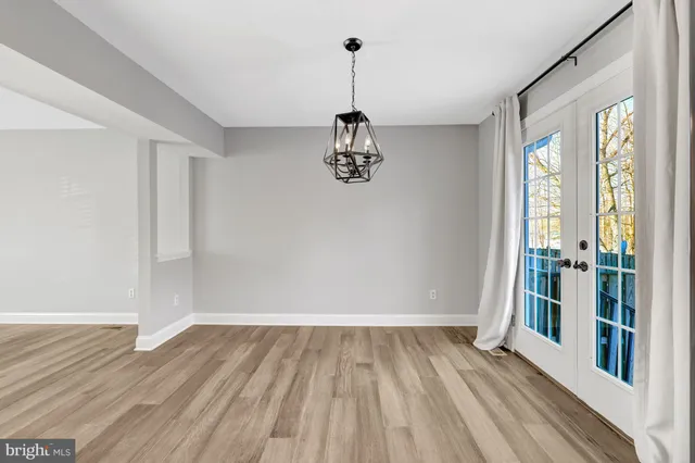 a view of a room with wooden floor staircase and windows