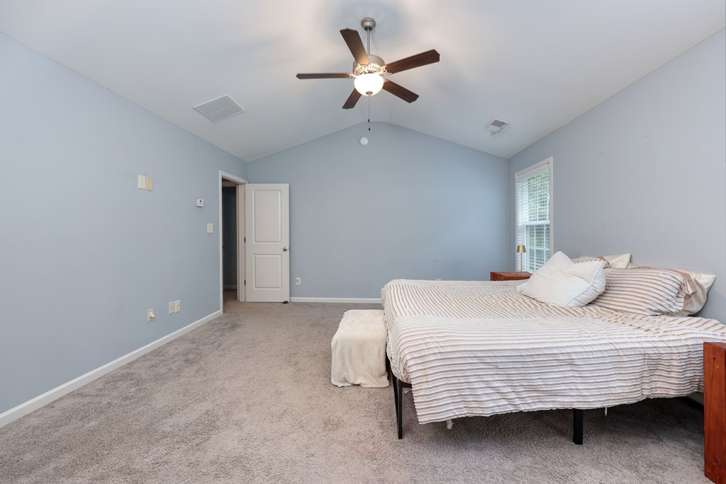 98 Valley Bluff Drive Hamilton, GA 31811 - Photo 18 of 35 a bedroom with a bed and a ceiling fan