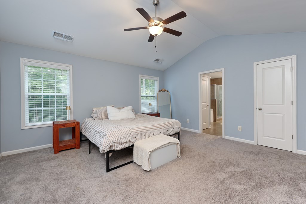 98 Valley Bluff Drive Hamilton, GA 31811 - Photo 19 of 35 a spacious bedroom with a bed and window