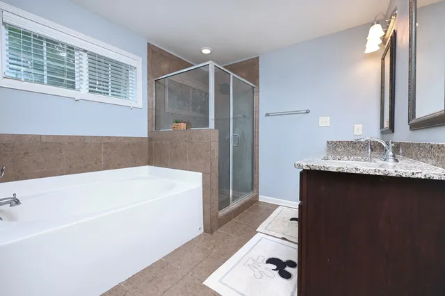 a bathroom with a bathtub and a sink