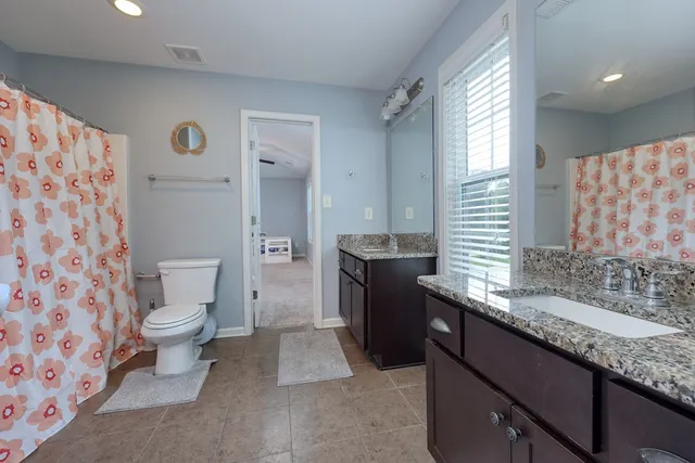 a view of bathroom with a toilet and a shower