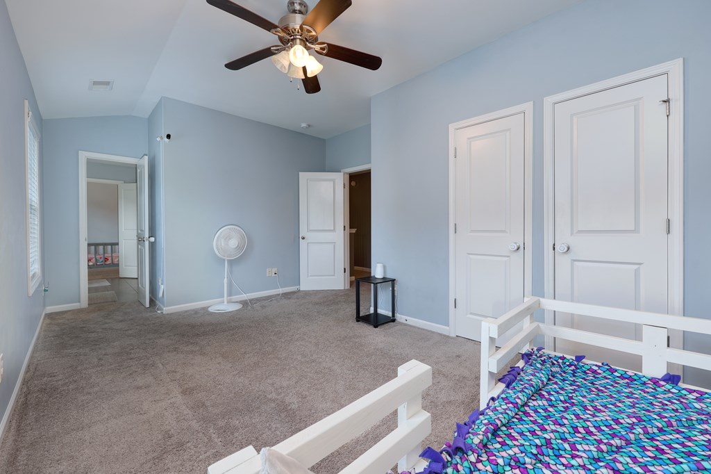 98 Valley Bluff Drive Hamilton, GA 31811 - Photo 26 of 35 a bedroom with a bed and a dresser