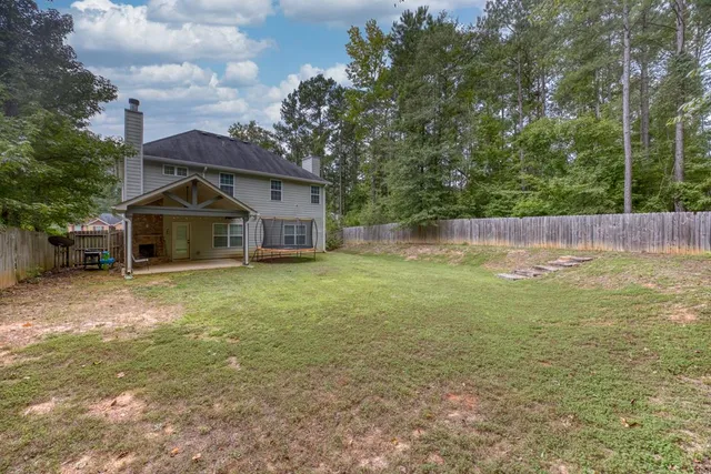 a house view with a garden space